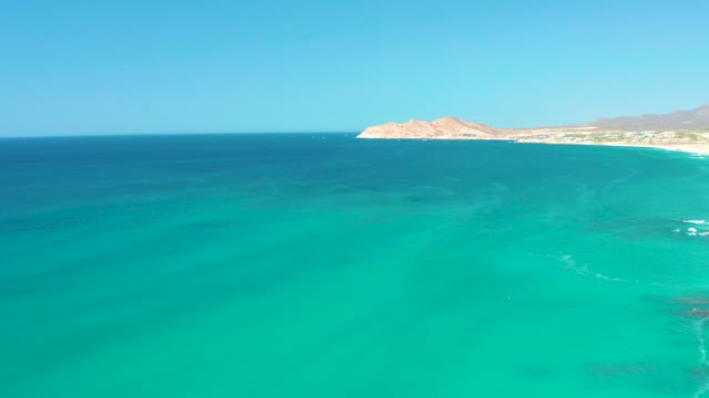 DREAMS LOS CABOS BCS MEXICO-2021: Turquoise Ocean Waves Along Sandy Shoreline