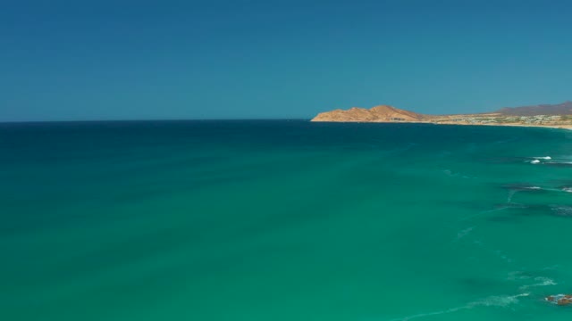 DREAMS LOS CABOS BCS MEXICO-2021: Gentle Ocean Waves Rolling Toward Sandy Shore
