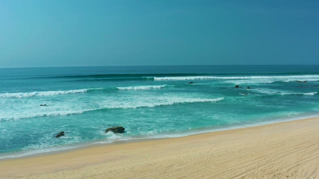 SAN LUIS BEACH EAST CAPE LOS CABOS MEXICO-2021: Gentle Ocean Waves Rolling Onto Sandy Beach