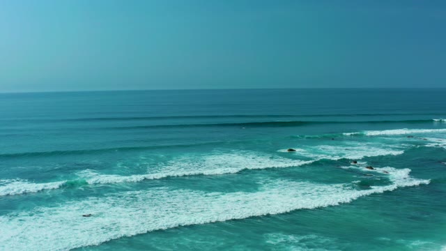 SAN LUIS BEACH EAST CAPE LOS CABOS MEXICO-2021: Ocean Waves with Surfers Approaching Shore