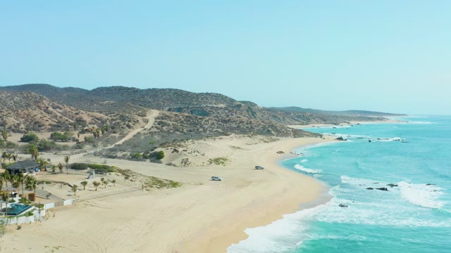 SAN LUIS BEACH EAST CAPE LOS CABOS MEXICO-2021: Vehicles Driving Along Coastal Beach Road