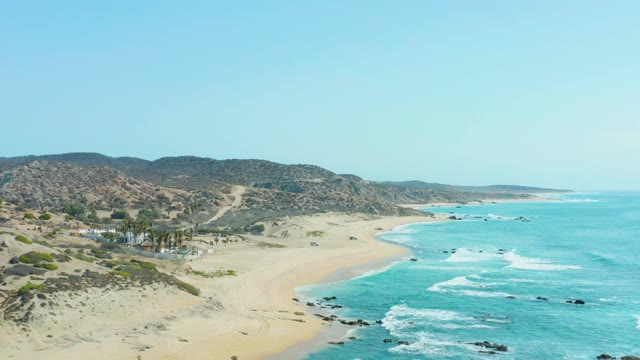 SAN LUIS BEACH EAST CAPE LOS CABOS MEXICO-2021: Vehicles Moving on Sandy Beach Road