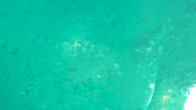 SAN LUIS BEACH EAST CAPE LOS CABOS MEXICO-2021: Clear Turquoise Water with Underwater Rocks and Wave Motion