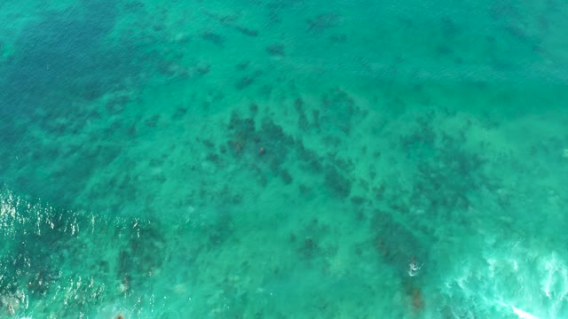 SAN LUIS BEACH EAST CAPE LOS CABOS MEXICO-2021: Shallow Ocean Water with Visible Coral and Moving Waves