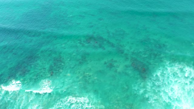 SAN LUIS BEACH EAST CAPE LOS CABOS MEXICO-2021: Clear Turquoise Ocean Water with Breaking Waves and Underwater Reefs