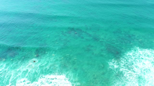 SAN LUIS BEACH EAST CAPE LOS CABOS MEXICO-2021: Turquoise Ocean Waves Breaking Over Shallow Reefs