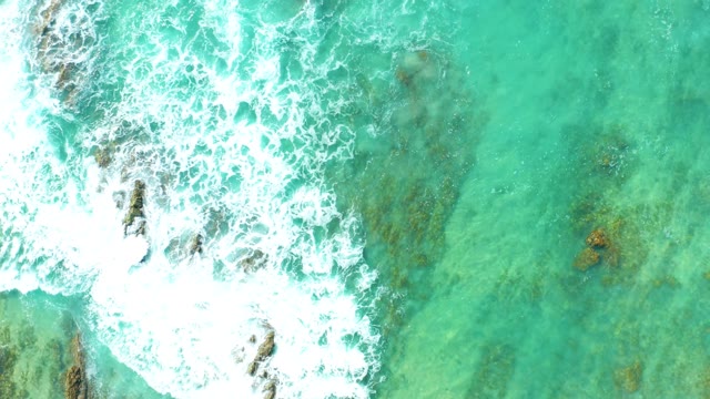 SAN LUIS BEACH EAST CAPE LOS CABOS MEXICO-2021: Waves Crashing on Rocky Ocean Seabed