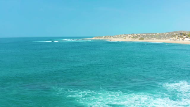 SAN LUIS BEACH EAST CAPE LOS CABOS MEXICO-2021: Ocean Waves Rolling Toward Sandy Shore