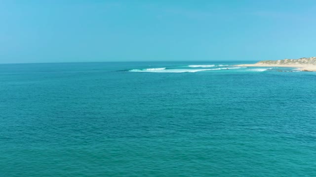 SAN LUIS BEACH EAST CAPE LOS CABOS MEXICO-2021: Gentle Ocean Waves and Coastal Shoreline