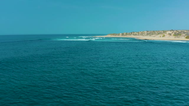 SAN LUIS BEACH EAST CAPE LOS CABOS MEXICO-2021: Waves Breaking on Sandy Shore with Dunes