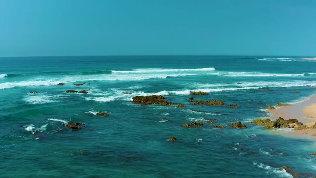 SAN LUIS BEACH EAST CAPE LOS CABOS MEXICO-2021: Waves Breaking on Rocky Coastal Shore