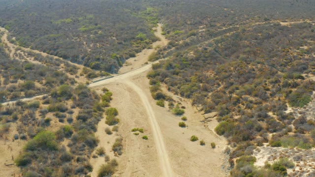 LOS FRALIES LOS CABOS BCS MEXICO-2021: Aerial View of Vehicle Moving on Dirt Road