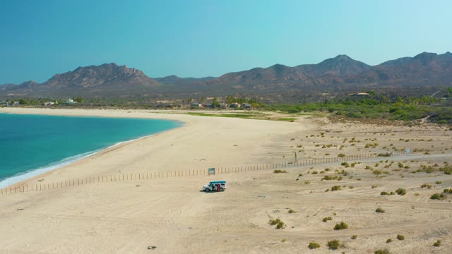 LOS FRALIES LOS CABOS BCS MEXICO-2021: Small Vehicle Driving Along Sandy Beach