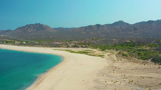 LOS FRALIES LOS CABOS BCS MEXICO-2021: Sandy Beach with Turquoise Water and Mountain Backdrop
