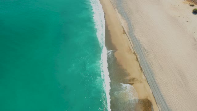 LOS FRALIES LOS CABOS BCS MEXICO-2021: Waves Rolling Onto Sandy Beach From Above