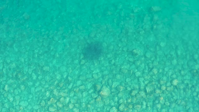 LOS FRALIES LOS CABOS BCS MEXICO-2021: Clear Turquoise Water Over Pebbled Seabed with Moving Shadow
