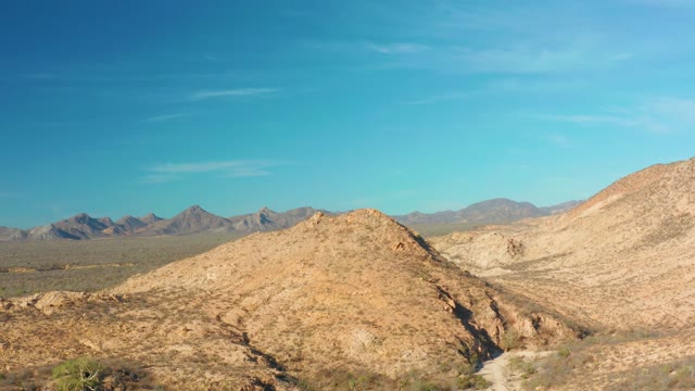 CABO PULMO BCS MEXICO-2021: Desert Landscape with Rocky Hills and Sparse Plants