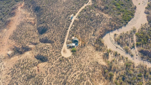 CABO PULMO BCS MEXICO-2021: A Vehicle Travels on a Dry Hillside Dirt Road