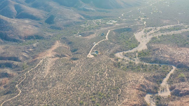 CABO PULMO BCS MEXICO-2021: Vehicle Moving on Arid Mountainous Dirt Road