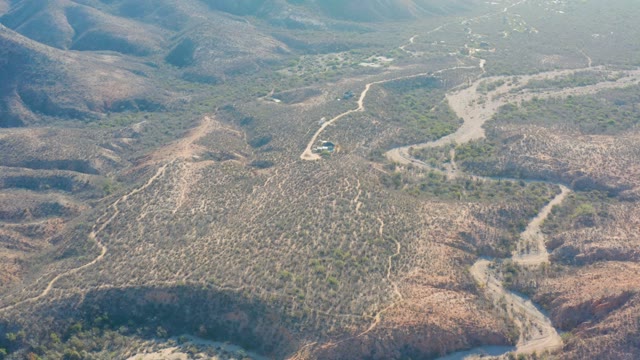 CABO PULMO BCS MEXICO-2021: Vehicle Traveling on Winding Dirt Roads in Arid Hills