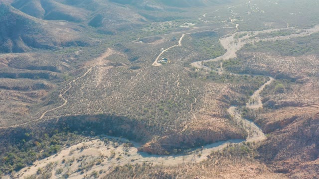 CABO PULMO BCS MEXICO-2021: Vehicle Driving on Winding Dirt Road Through Hills