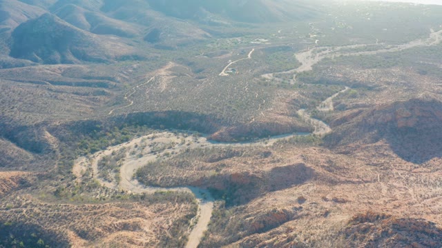CABO PULMO BCS MEXICO-2021: Vehicle Moving Along Desert's Winding Dirt Road