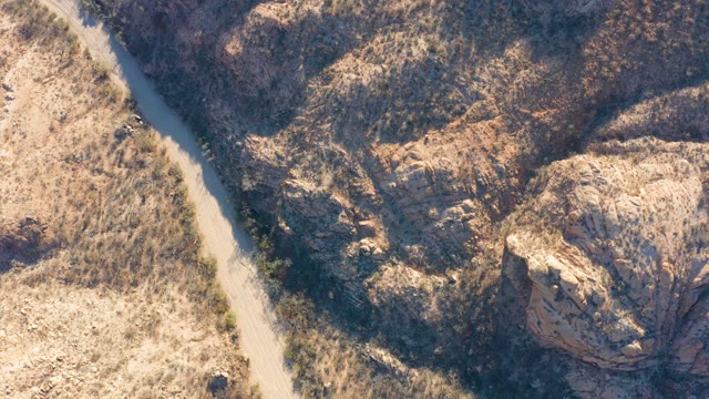 CABO PULMO BCS MEXICO-2021: Narrow Dirt Road Winding Through Arid Rocky Terrain