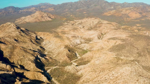 CABO PULMO BCS MEXICO-2021: Vehicle Moving Along Mountain Valley Path