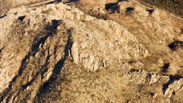CABO PULMO BCS MEXICO-2021: Aerial Pan Over Rocky Hillside with Dry Grass