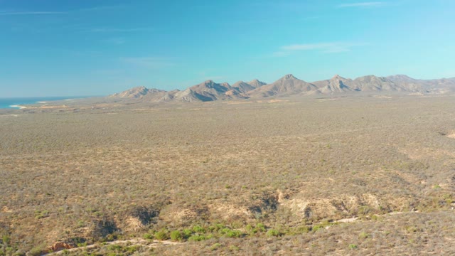CABO PULMO BCS MEXICO-2021: Distant Mountain Range over Arid Desert Landscape