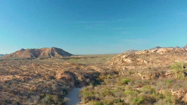 CABO PULMO BCS MEXICO-2021: Dirt Path Through Arid Desert Landscape