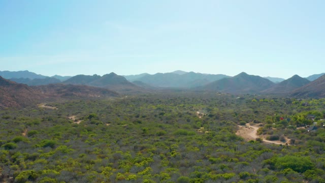 CABO PULMO BCS MEXICO-2021: Vehicle Driving on Desert Valley Road, Creating Dust
