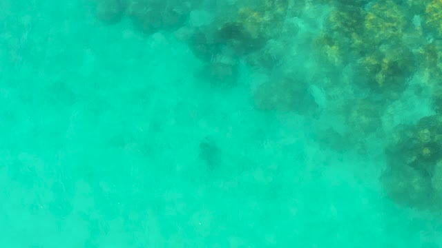 Clear Turquoise Water Revealing Underwater Rock Formations