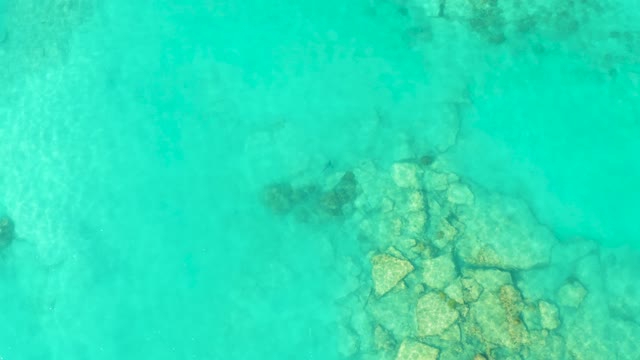 Clear Turquoise Water Over Rocky Seabed