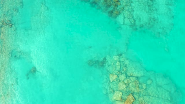 Turquoise Water Revealing Submerged Rock Formations