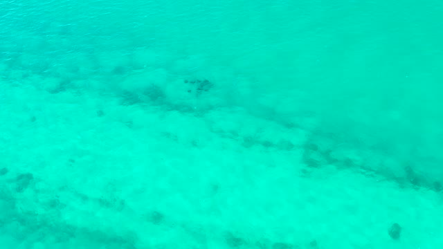 Turquoise Water Revealing Sandy Ocean Floor