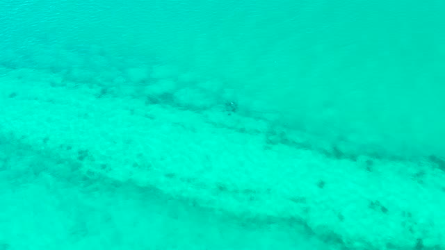 Clear Turquoise Water Over Sandy Ocean Floor