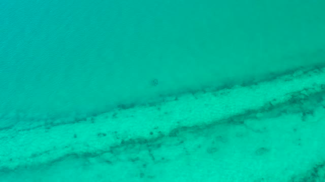 Turquoise Ocean Water Revealing Seabed