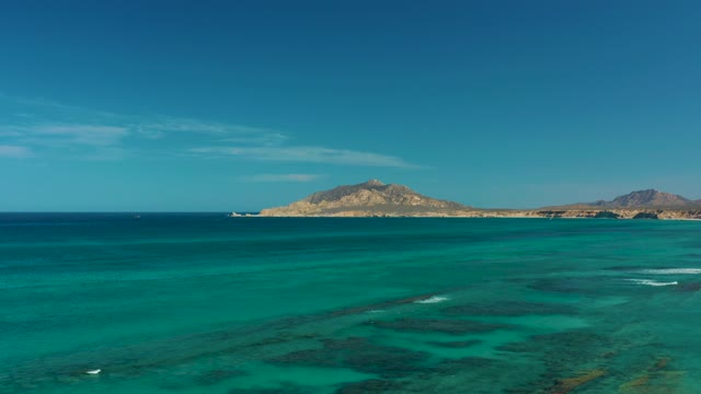 Clear Turquoise Ocean Waters and Distant Island