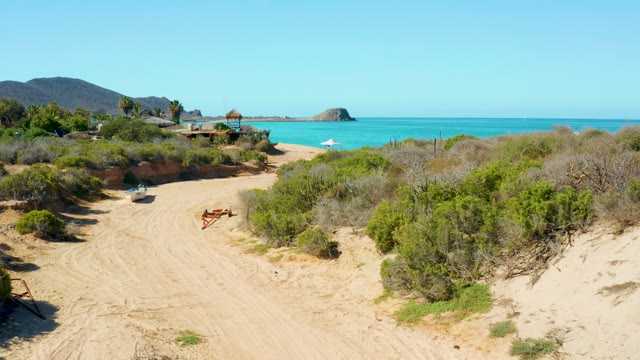 Sandy Path Leading to Beach with Vanishing Umbrella