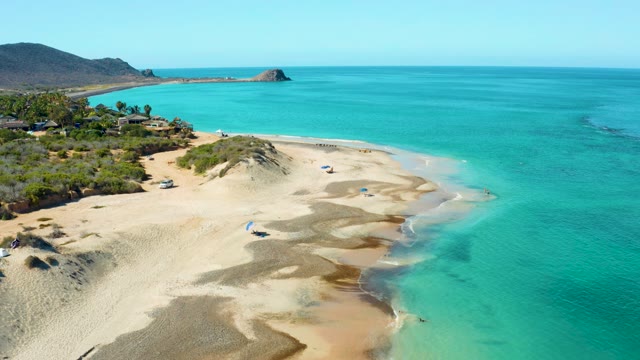 Sandy Beach and Turquoise Ocean Aerial Approach