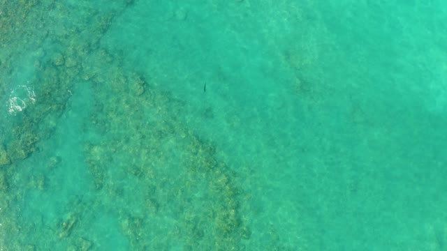 Shallow Turquoise Water with Visible Underwater Reefs