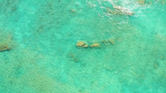 Clear Turquoise Water Over Submerged Rocks