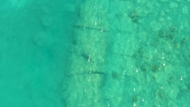 Underwater Stone Structure in Shallow Turquoise Water