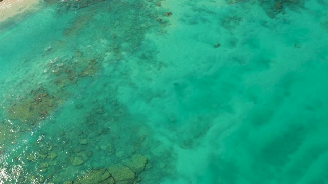 Boat Moving Through Clear Turquoise Ocean Waters