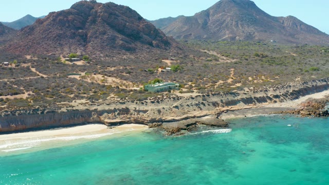 Coastal Landscape with Turquoise Waters and Mountain Backdrop