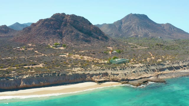 Coastal Mountain Landscape with Sandy Beach and Turquoise Water