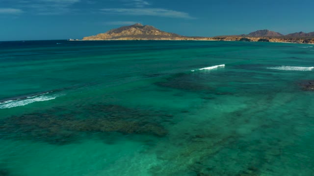 Waves Moving Across Turquoise Ocean Waters