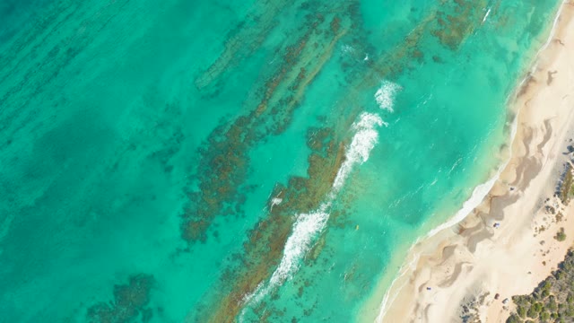 Gentle Ocean Waves Rolling Toward Sandy Beach