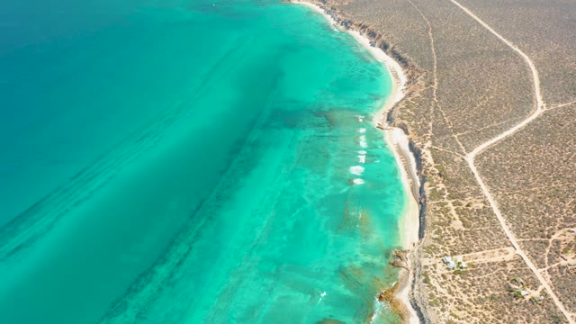 Turquoise Coastal Waters with Moving Boats